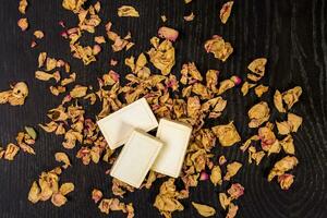 bath soap with dry rose petal closeup photo