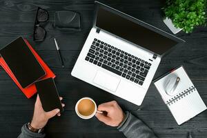 Directly above view of human hands typing on laptop. photo