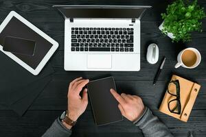 Directly above view of human hands typing on laptop. photo