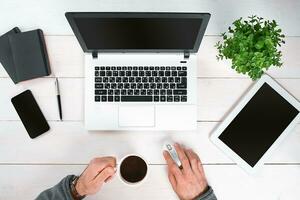Directly above view of human hands typing on laptop. photo
