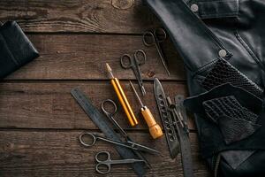 Leather products. Work place craftsman in a workshop. Top view photo