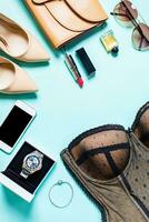 Women's clothes and accessories on a turquoise background photo