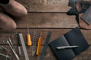 Leather crafting. Tools flat lay still life photo