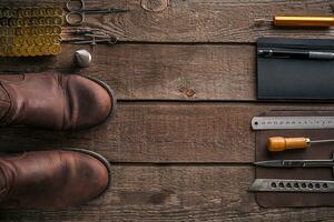 Leather handbag. Work place craftsman in a workshop. Top view photo