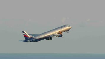 SOCHI, RUSSIA AUGUST 02, 2022 Airbus A320 of Aeroflot aircraft taking off at Sochi airport, side view. Tourism and travel concept video