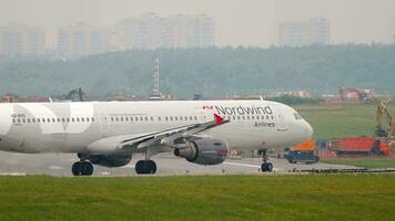 MOSCOW, RUSSIAN FEDERATION JULY 30, 2021 Airbus A321 211, VQ BOD of Nordwind passenger plane taxiing. Airliner on the taxiway. Sheremetyevo airport, airfield video