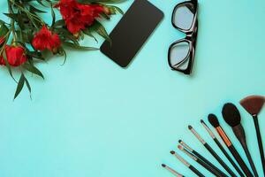 Make up essentials. Set of professional make up brushes on blue background. photo