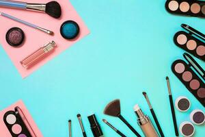 The women's cosmetics set on a blue background, modern woman. photo