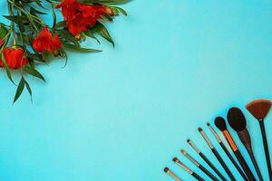 Various brushes on blue background photo