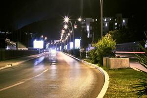 Night street in the town of Budva. Montenegro, Balkans, Europe. photo