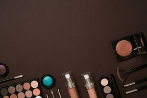 The women's cosmetics set on a brown background, modern woman. photo