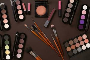 The women's cosmetics set on a brown background, modern woman. photo