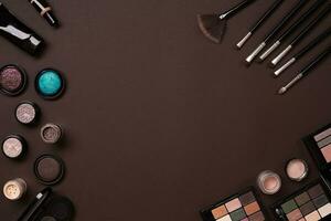 The women's cosmetics set on a brown background, modern woman. photo