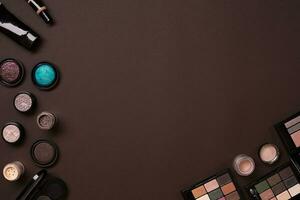 Various cosmetics on brown background photo