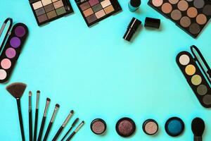 The women's cosmetics set on a blue background, modern woman. photo