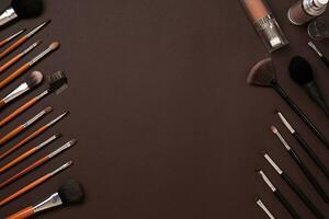 brush for makeup, eye shadow, view from above. On a brown background photo