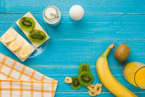 Top view of toast with butter and fruits photo