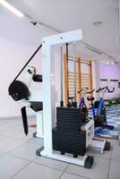 a gym room with exercise equipment photo