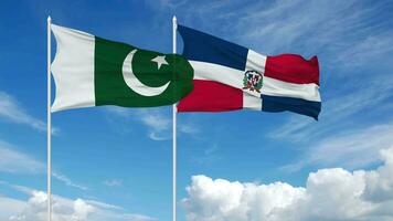Paquistão e dominicano república bandeiras acenando juntos dentro a céu, desatado ciclo dentro vento, 3d Renderização video
