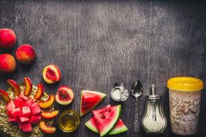 Ingredients for oatmeal on dark wooden table. Concept of healthy food. Top view, copy space. Toned photo