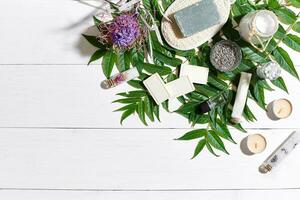 Composition of spa treatment on white wooden table with space for text. Top view photo