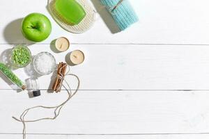 Composition of spa treatment on white wooden table with space for text. Top view photo