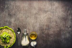 Healthy breakfast ingredients. Bowl of oat granola, fresh fruit and honey. Top view, copy space. Toned photo