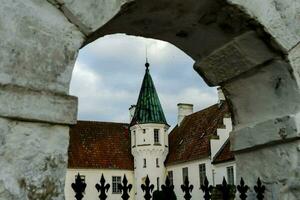 a view of a church through an archway photo