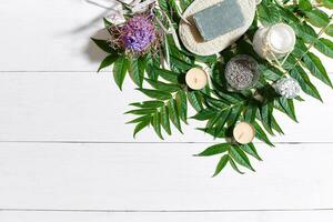 Composition of spa treatment on white wooden table with space for text. Top view photo