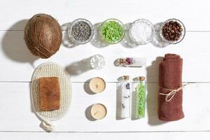 Composition of spa treatment on white wooden table with space for text. Top view photo