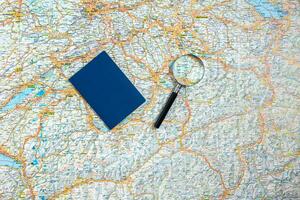 Preparation for travel, passport and map for vacation time. Top view photo