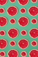 Grapefruit pattern isolated on blue background. Flat lay photo