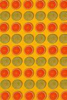 Grapefruit and lime pattern on yellow background. Minimal flat lay concept. photo