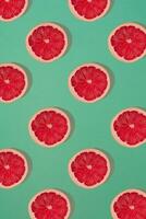 Grapefruit pattern isolated on blue background. Flat lay photo