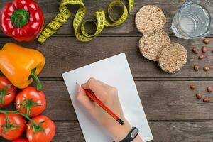 Concept diet, slimming plan with vegetables top view mock up photo