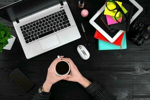 Overhead view of businesswoman working at computer in office photo