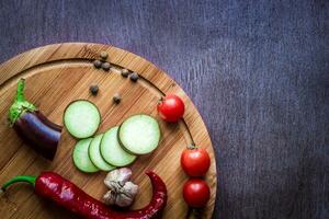 Healthy eating, vegetarian food. Raw eggplant prepared for frying in a frying pan with spices in olive oil photo