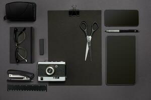 Workplace with office items and business elements on a desk. Concept for branding. Top view. photo