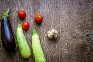 Healthy eating, vegetarian food. Raw zucchini prepared for frying in a frying pan with spices in olive oil photo