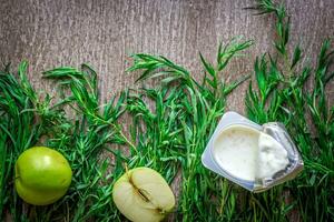 Healthy and delicious yogurt with green apple photo