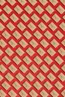 Craft paper present boxes tied from rope on red background. Pattern photo