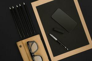 Mix of office supplies on a modern desk photo