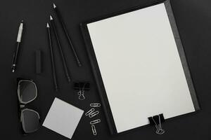 Mix of office supplies and business gadgets on a modern desk photo