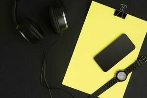 Top view of office supplies on blackboard background with copy space. photo