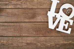 ring on wooden table photo