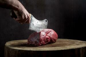 Juicy raw beef steak on wooden table photo