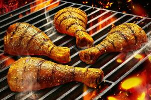 Grilled chicken Legs on the grill fire photo