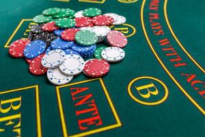 Poker chips on a table at the casino photo