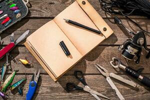 Accessories for fishing on the background of wood. Top view photo