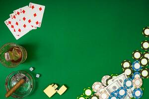 Set to playing poker with cards and chips on green background photo